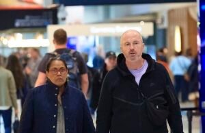 Depois de uma rara aparição pública na frente de milhares de fãs, Kathy Freeman foi recuperada com seu homem misterioso