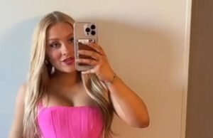 ACIMA. de Kentucky Cheerleader foi preso depois que uma criança morta é encontrada em sua capa